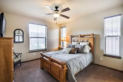 a bedroom with a bed and a ceiling fan at Patio, Fire Pit, and Ski Mountain View Granby Home in Granby