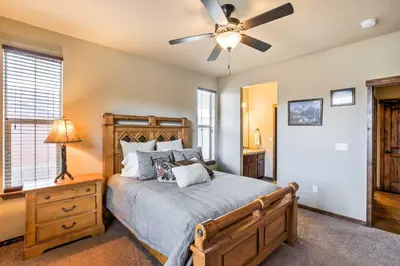 a bedroom with a bed and a ceiling fan at Patio, Fire Pit, and Ski Mountain View Granby Home in Granby