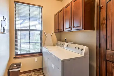 a kitchen with a washing machine and a window at Patio, Fire Pit, and Ski Mountain View Granby Home in Granby