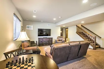 a living room filled with furniture and a chess board at Patio, Fire Pit, and Ski Mountain View Granby Home in Granby