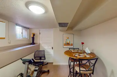 a room with a table and two chairs and a table withizers at Elati Guesthouse Walkable Home in Arts District in Denver