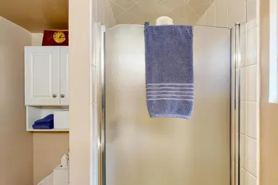 a silver refrigerator with a blue towel on it at Elati Guesthouse Walkable Home in Arts District in Denver