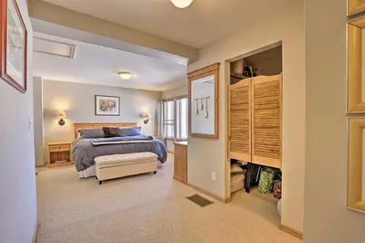 a bedroom with a bed and a walk in closet at Pet-Friendly Fraser Condo with Community Hot Tub in Fraser