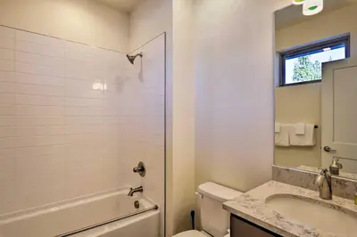 a white bathroom with a sink and a toilet at Mountain Escape with Hot Tub Less Than 5 Mi to Winter Park! in Fraser