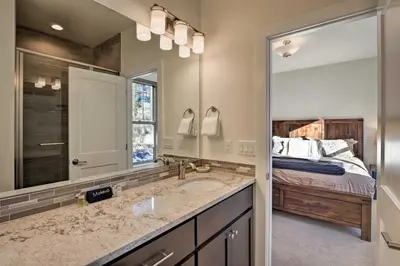 a bathroom with a sink and a large mirror at Mountain Escape with Hot Tub Less Than 5 Mi to Winter Park! in Fraser