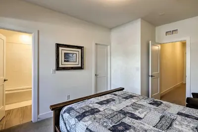a bedroom with a bed with a quilt on it at Mountain Escape with Hot Tub Less Than 5 Mi to Winter Park! in Fraser