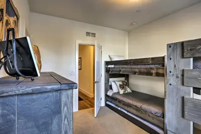 a room with two bunk beds and a tv at Mountain Escape with Hot Tub Less Than 5 Mi to Winter Park! in Fraser