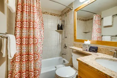 a bathroom with a tub and a toilet and a sink at Ski and Relax Fireside Frisco Gem with Resort Perks! in Frisco