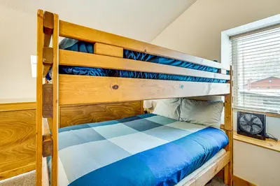 a bedroom with a bunk bed and a window at Ski and Relax Fireside Frisco Gem with Resort Perks! in Frisco