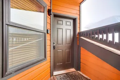 a door on a house with a balcony at Ski and Relax Fireside Frisco Gem with Resort Perks! in Frisco