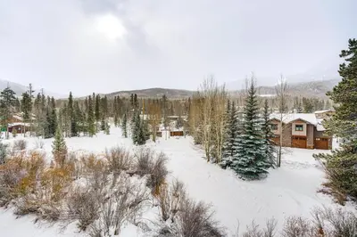 a snow covered yard with houses and trees at Ski and Relax Fireside Frisco Gem with Resort Perks! in Frisco