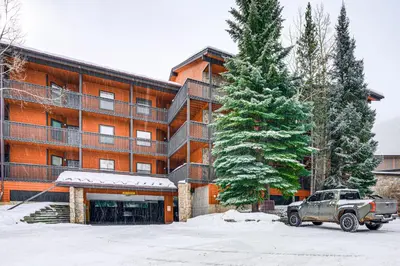a truck parked in a parking lot in front of a building at Ski and Relax Fireside Frisco Gem with Resort Perks! in Frisco