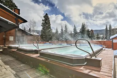 a large swimming pool with a hot tub on a deck at Ski and Relax Fireside Frisco Gem with Resort Perks! in Frisco