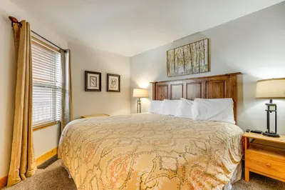 a bedroom with a large bed and a window at Ski and Relax Fireside Frisco Gem with Resort Perks! in Frisco