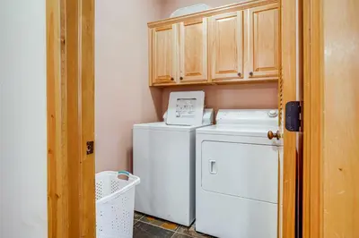 a small laundry room with a washer and dryer at 2 Mi to Frisco Slopes Cozy Retreat with Mtn Views! in Frisco