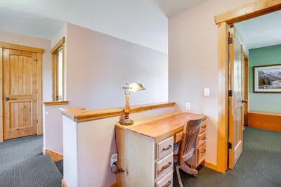 a home office with a desk and a lamp at 2 Mi to Frisco Slopes Cozy Retreat with Mtn Views! in Frisco