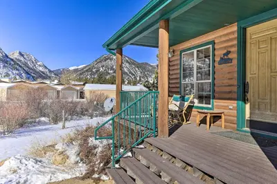 a house with a wooden porch with a door at 2 Mi to Frisco Slopes Cozy Retreat with Mtn Views! in Frisco