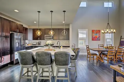 a kitchen and dining room with a table and chairs at 3 Mi to Granby Ranch Expansive Granby Retreat! in Granby