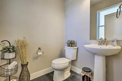 a bathroom with a toilet and a sink at 3 Mi to Granby Ranch Expansive Granby Retreat! in Granby