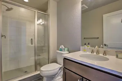 a bathroom with a shower and a toilet and a sink at 3 Mi to Granby Ranch Expansive Granby Retreat! in Granby
