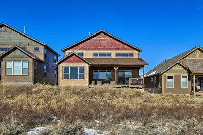 three homes on a hill withgrass at 3 Mi to Granby Ranch Expansive Granby Retreat! in Granby