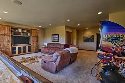 a large living room with a couch and a television at 6 Mi to Slopes Breck Home with Hot Tub and Game Room in Breckenridge