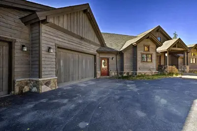 a large house with a driveway in front of it at 6 Mi to Slopes Breck Home with Hot Tub and Game Room in Breckenridge