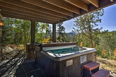 a jacuzzi tub with a view of the woods at 6 Mi to Slopes Breck Home with Hot Tub and Game Room in Breckenridge
