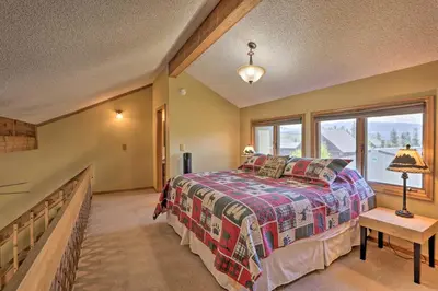 a bedroom with a bed and a large window at Townhome with Club Access on Shuttle Stop in Fraser