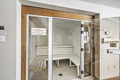 a glass door with a bench inside of a room at Townhome with Club Access on Shuttle Stop in Fraser