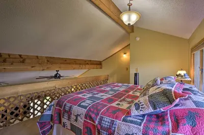 a bedroom with a bed on a balcony at Townhome with Club Access on Shuttle Stop in Fraser