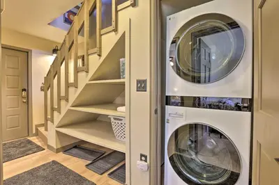 a laundry room with a washer and dryer at Townhome with Club Access on Shuttle Stop in Fraser