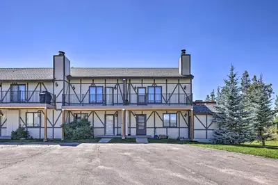 a large house with a driveway in front of it at Townhome with Club Access on Shuttle Stop in Fraser