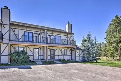 a large white house with a driveway in front of it at Townhome with Club Access on Shuttle Stop in Fraser