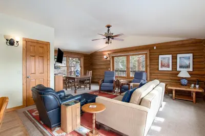 a living room with a couch and a table at Bishop's Retreat in Estes Park