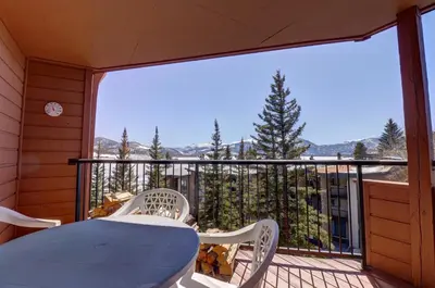 a porch with a table and chairs on a balcony at 432 Marina Place condo in Dillon