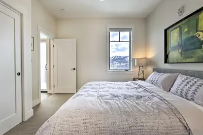 a bedroom with a large bed and a window at Winter Park Condo Proximity to Cafes and Rec Center in Winter Park