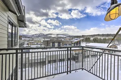 a balcony with a view of the snow covered mountains at Winter Park Condo Proximity to Cafes and Rec Center in Winter Park