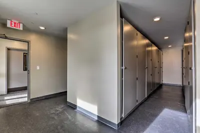 an empty hallway with a row of elevators in a building at Winter Park Condo Proximity to Cafes and Rec Center in Winter Park