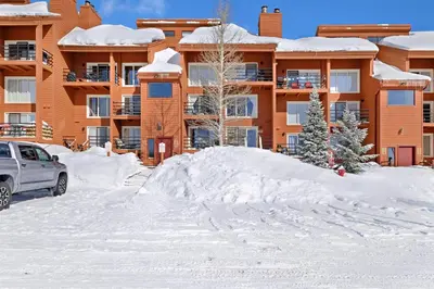 a pile of snow in front of a building at Timber Ridge Condo in Silverthorne