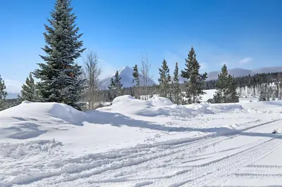 a pile of snow with a tree in the background at Timber Ridge Condo in Silverthorne