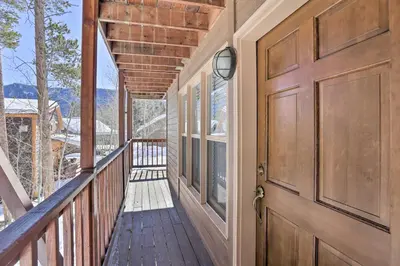a wooden door on a house with a balcony at Walk to Marina Rustic Grand Lake Retreat! in Grand Lake
