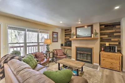 a living room with a couch and a fireplace at Walk to Marina Rustic Grand Lake Retreat! in Grand Lake