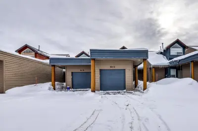 a house with two garage doors in the snow at Cydney Ln 61C in Silverthorne