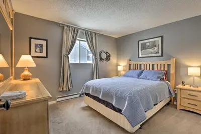 a bedroom with a bed and a desk and a window at Cozy Fraser Mtn Retreat with Shuttle to Winter Park in Fraser