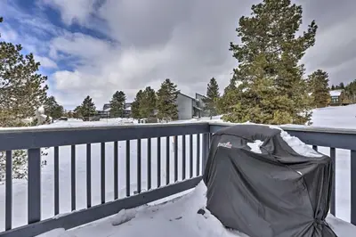 a yard covered in snow with a garbage bag on a fence at Cozy Fraser Mtn Retreat with Shuttle to Winter Park in Fraser