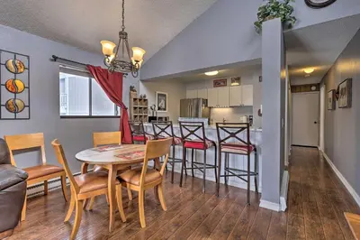 a dining room and kitchen with a table and chairs at Cozy Fraser Mtn Retreat with Shuttle to Winter Park in Fraser