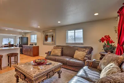 a living room with a couch and a table at Private Yard and Patio Denver Area Home! in Northglenn