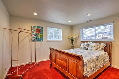 a bedroom with a bed and a window at Private Yard and Patio Denver Area Home! in Northglenn