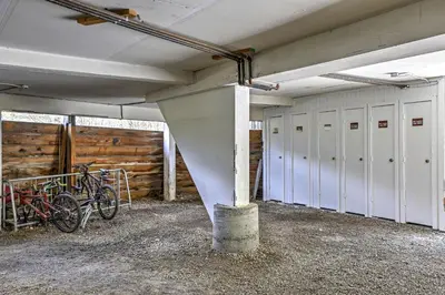 a row of bikes parked in a room with stalls at Walk to Village Condo with Resort Perks in Keystone in Keystone